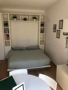 A bed or beds in a room at Music House - Carozzi Apartments