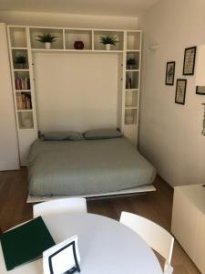 A bed or beds in a room at Music House - Carozzi Apartments