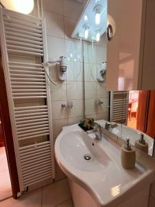 a bathroom with a sink and a mirror at Dela in Hvar