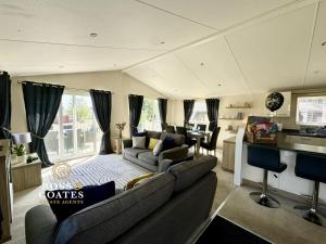 a living room with a couch and a table at 2 The Green in Tattershall