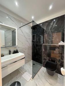 a bathroom with a shower and a toilet and a sink at Dela in Hvar