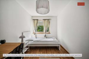 Ein Bett oder Betten in einem Zimmer der Unterkunft Simple and Cozy Flat in Zurich
