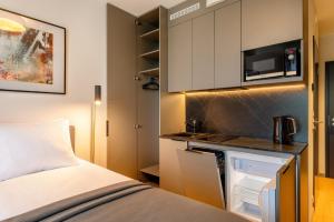 Kuchyň nebo kuchyňský kout v ubytování Hessnery Hotel