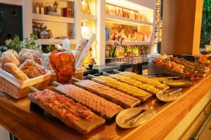 a buffet of bread and pastries on a table at The Click Clack Hotel Bogotá in Bogotá