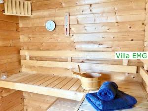 a sauna with a bench in a wooden wall at Luxury Villa EMG Frankfurt Heidelberg - Bensheim in Bensheim