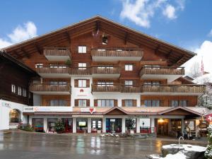 a large building with balconies on top of it at Apartment Chalet Abendrot apARTments-18 by Interhome in Grindelwald