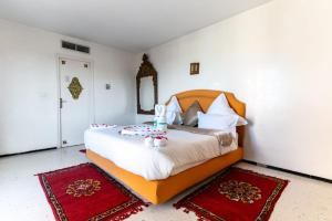 Postel nebo postele na pokoji v ubytování Hotel Le Grand Imilchil