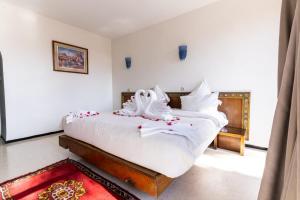 Postel nebo postele na pokoji v ubytování Hotel Le Grand Imilchil