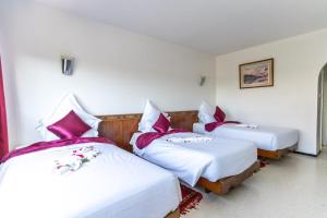 Postel nebo postele na pokoji v ubytování Hotel Le Grand Imilchil