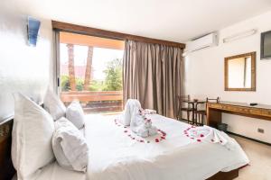 Postel nebo postele na pokoji v ubytování Hotel Le Grand Imilchil