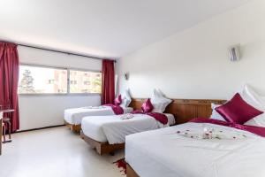 Postel nebo postele na pokoji v ubytování Hotel Le Grand Imilchil