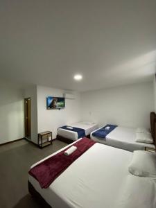 Postel nebo postele na pokoji v ubytování Hotel Gallery By 70