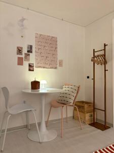 a table and a chair in a room at Sillim Leo's House in Seoul