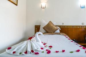 Postel nebo postele na pokoji v ubytování Hotel Le Grand Imilchil