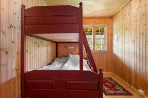 Letto a castello in una casetta minuscola di Langlete gjestehus a Gilset