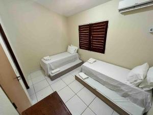 En eller flere senge i et værelse på Casa a Beira Mar + 13 billeder