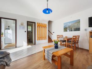 a living room with a table and a kitchen at Holiday Home Dul by Interhome in Lovas