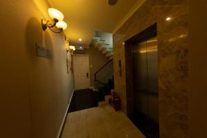 a hallway with a stairway with a door and a hallway at Anpha Boutique Hotel in Ho Chi Minh City