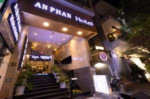 a store front of an palm hotel at night at Anpha Boutique Hotel in Ho Chi Minh City