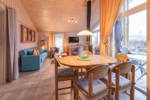 a living room with a table and a couch at Seeschwalbe 54 in Rechlin