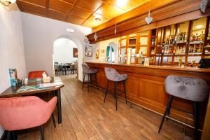 a bar with chairs and a counter in a restaurant at Hotel Radnice in Liberec