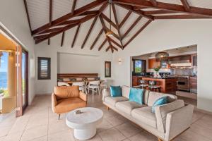 a living room with a couch and a table at Casa Tranquilidad in Willemstad