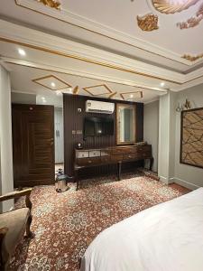 En eller flere senger på et rom på Hotel Delight Skardu