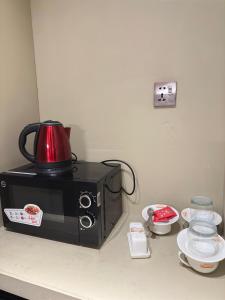 Kaffemaskin og/eller vannkoker på Hotel Delight Skardu