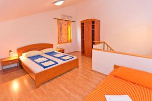 Postel nebo postele na pokoji v ubytování Apartments Nautic