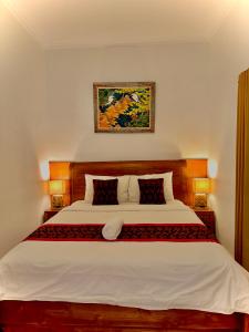 Postel nebo postele na pokoji v ubytování Intan Guest House