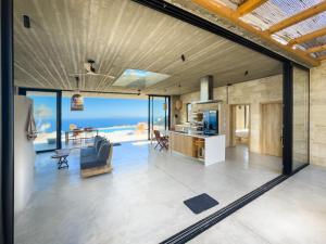 an open living room with a view of the ocean at Sea view villa with private swimming pool in Heraklio +10 photos