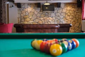 a pool table in a room with afits at Pensiunea Casa Nostalgia in Bran