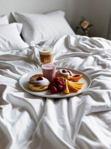 Postel nebo postele na pokoji v ubytování Hotel Naica