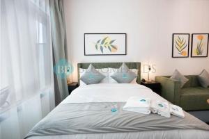 Ένα ή περισσότερα κρεβάτια σε δωμάτιο στο Bloomfields Executive Stu In Oasis Masdar City