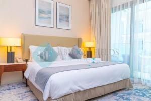 Postel nebo postele na pokoji v ubytování Bloomfields 2brmaid Address Beach Fujairah