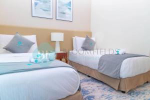 Postel nebo postele na pokoji v ubytování Bloomfields 2brmaid Address Beach Fujairah