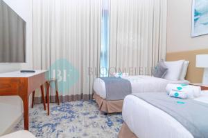Postel nebo postele na pokoji v ubytování Bloomfields 2brmaid Address Beach Fujairah