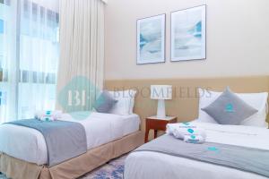 Postel nebo postele na pokoji v ubytování Bloomfields 2brmaid Address Beach Fujairah