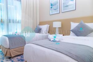 Postel nebo postele na pokoji v ubytování Bloomfields 2brmaid Address Beach Fujairah
