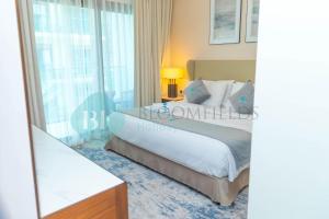 Postel nebo postele na pokoji v ubytování Bloomfields 2brmaid Address Beach Fujairah