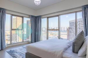 Postel nebo postele na pokoji v ubytování Bloomfields Iconic 2br In Wave Tower + 11 fotografií