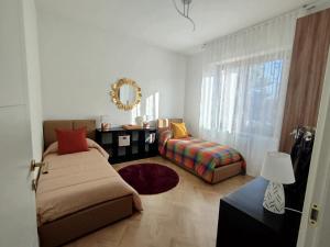 Una cama o camas en una habitación de La Dama dei Fiori