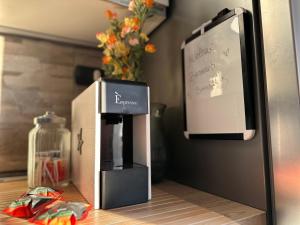 a box sitting on a counter next to a refrigerator at Casa dolce casa - Metro in Sesto San Giovanni