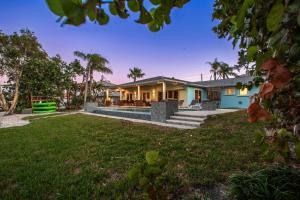 an exterior view of a house with a yard at Sunset Splash in Clearwater Beach
