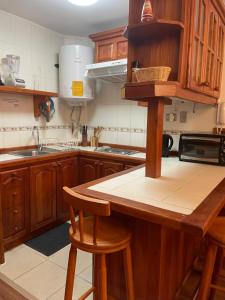 Kuchyň nebo kuchyňský kout v ubytování Acogedor Departamento en Zona Lacustre