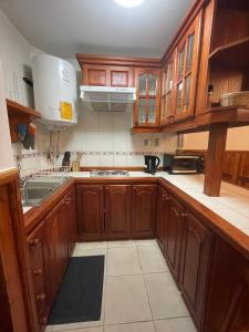 Kuchyň nebo kuchyňský kout v ubytování Acogedor Departamento en Zona Lacustre