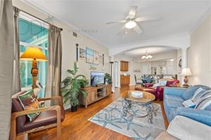 a living room with a couch and a table at Legacy Tower Two 1202 Deluxe in Gulfport
