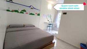 Postel nebo postele na pokoji v ubytování MUSANG ONG HOTEL