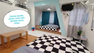 Postel nebo postele na pokoji v ubytování MUSANG ONG HOTEL