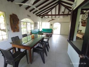 a dining room with a table and chairs at La Ceja Beach House in El Tamarindo